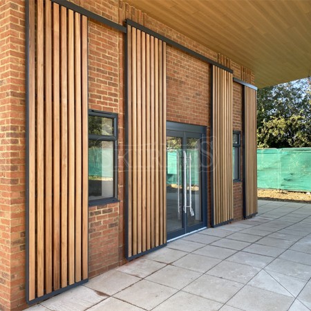 SKIRPUS  sliding shutters with vertical cedar wooden louvers in High Wycombe (UK)
