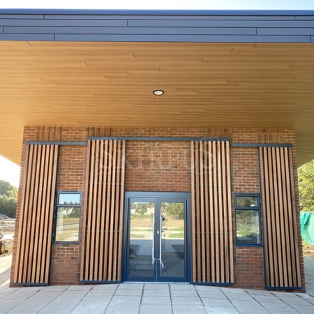 SKIRPUS  sliding shutters with vertical cedar wooden louvers in High Wycombe (UK)